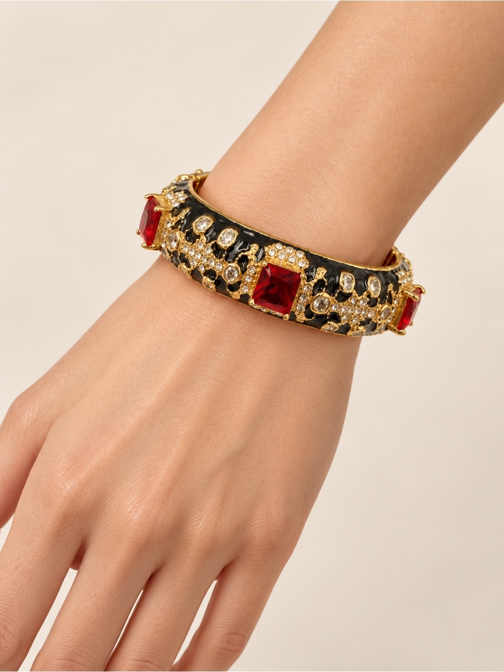 Gold-Tone Black Enamel Bracelet with Red Crystal Accents